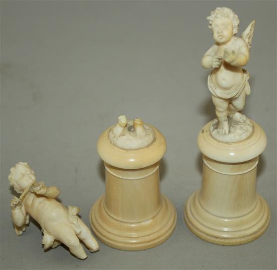 A pair of late 19th / early 20th century European carved ivory figures of winged cherubs, 4.25in. some damage